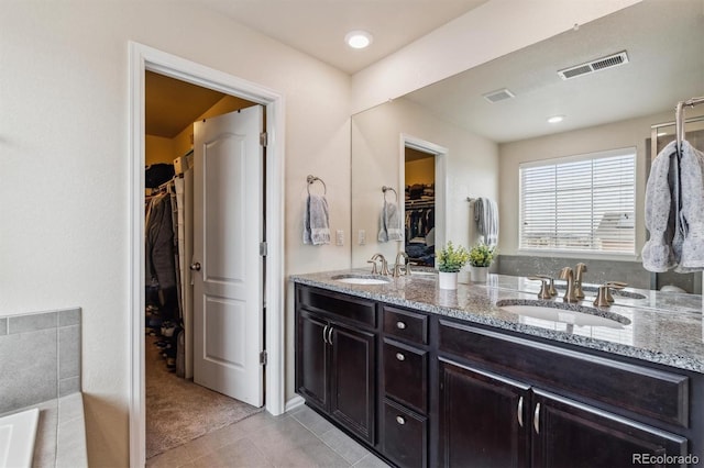 bathroom with vanity and tile patterned floors