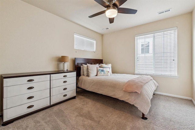 bedroom featuring light carpet and ceiling fan