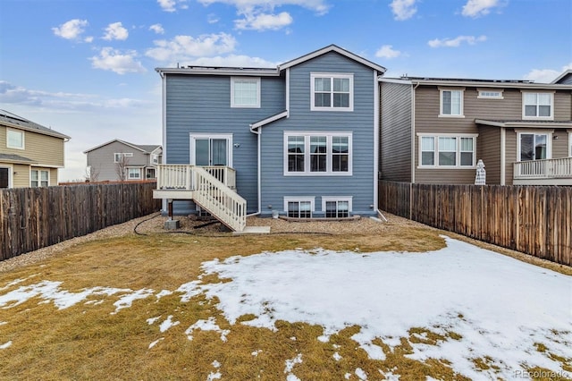 snow covered property with a yard