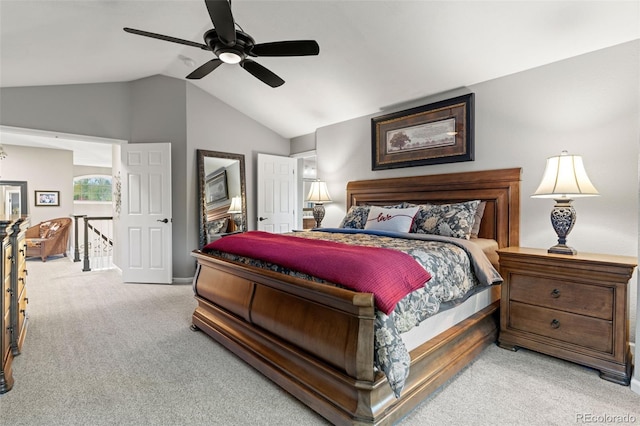 bedroom featuring light carpet, ceiling fan, and vaulted ceiling