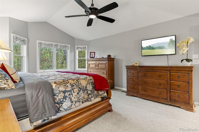 carpeted bedroom featuring lofted ceiling, ceiling fan, and baseboards