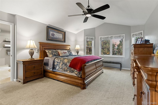 bedroom featuring light carpet, ceiling fan, vaulted ceiling, and baseboards