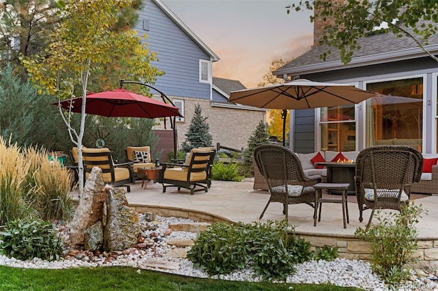 patio terrace at dusk with an outdoor hangout area