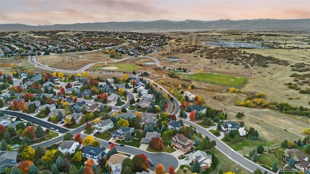 aerial view at dusk with a residential view and a mountain view