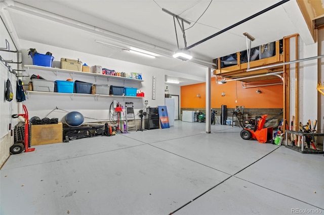 garage with freestanding refrigerator