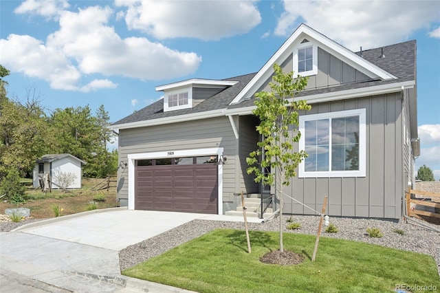 view of front of home with a garage and a front yard