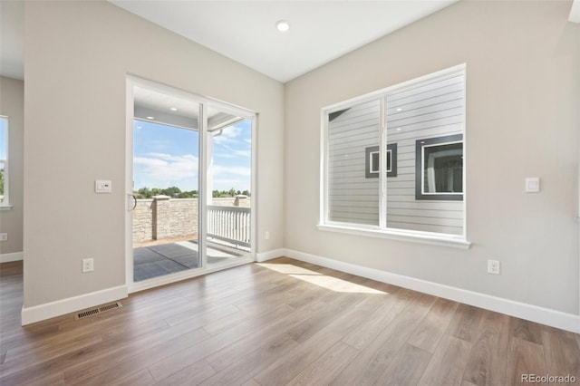 unfurnished room featuring light hardwood / wood-style flooring