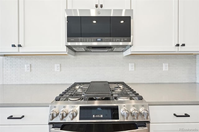 kitchen featuring white cabinetry, tasteful backsplash, and stainless steel appliances