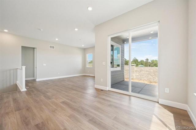 unfurnished room with light hardwood / wood-style flooring