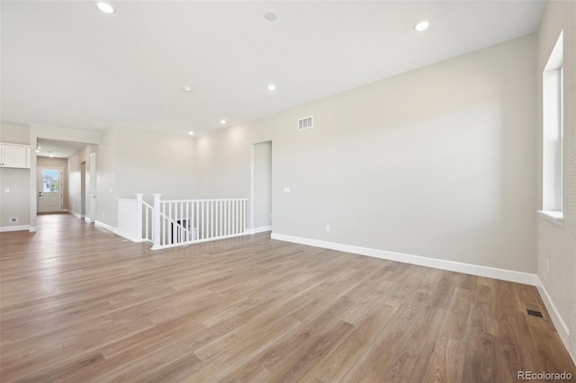 unfurnished room featuring light hardwood / wood-style floors