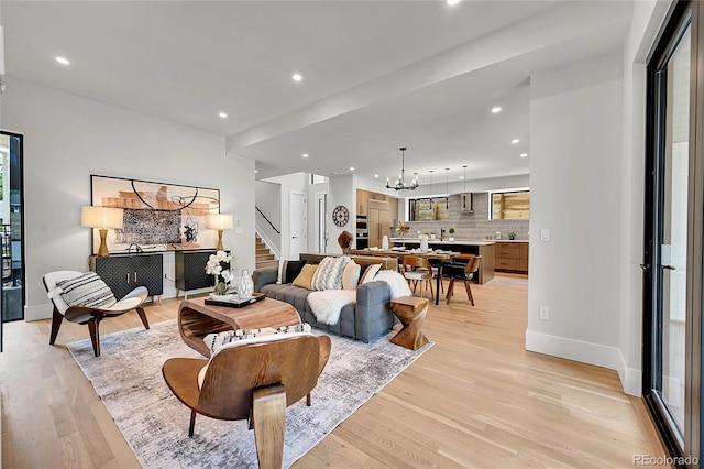 1029 9th St, Boulder, CO 80302 - living area with a chandelier, stairs, light wood-style flooring, and recessed lighting