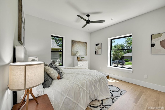1029 9th St, Boulder, CO 80302 - bedroom with multiple windows, light wood-style flooring, and a ceiling fan