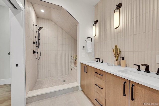 1029 9th St, Boulder, CO 80302 - bathroom featuring tiled shower, double vanity, and recessed lighting