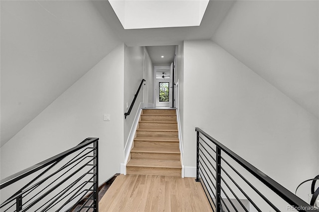 1029 9th St, Boulder, CO 80302 - stairs with wood finished floors, vaulted ceiling, and a skylight