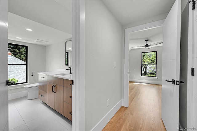 1029 9th St, Boulder, CO 80302 - bathroom featuring vanity, ceiling fan, recessed lighting, and wood finished floors