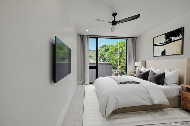 1029 9th St, Boulder, CO 80302 - bedroom with expansive windows, light colored carpet, a ceiling fan, and access to exterior