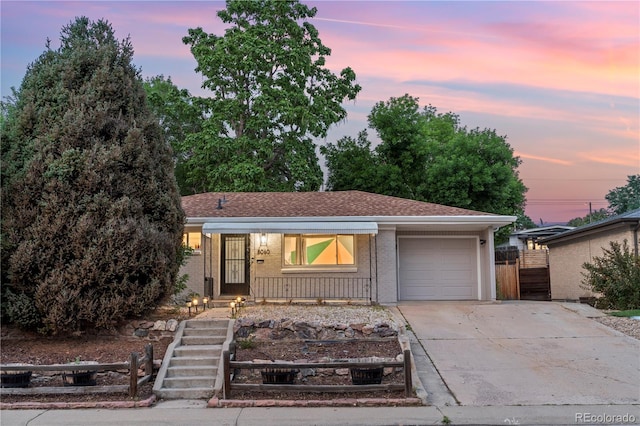 8060 Stuart Pl, Westminster, CO 80031 - single story home featuring an attached garage, driveway, and brick siding