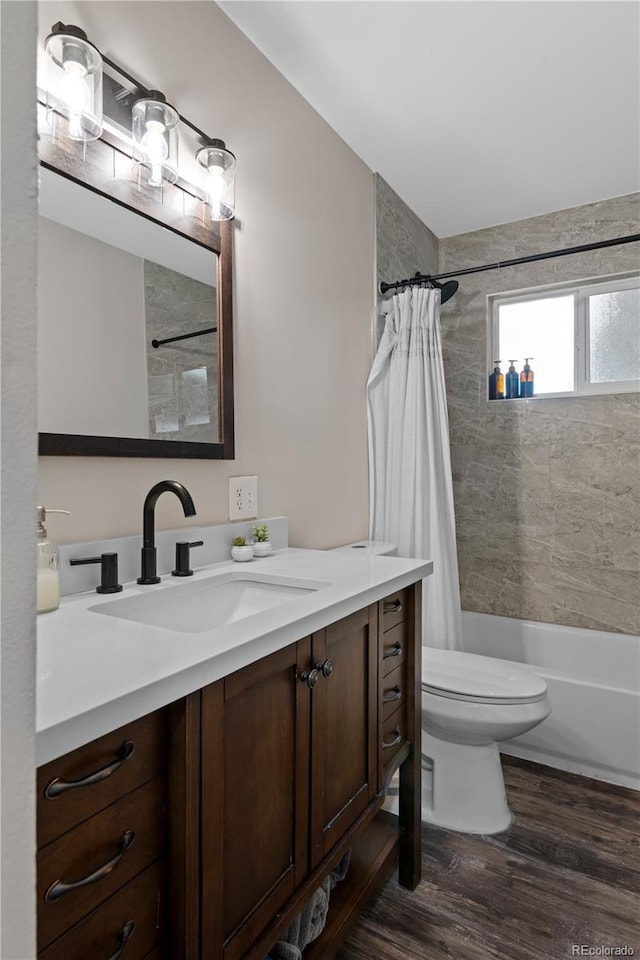 8060 Stuart Pl, Westminster, CO 80031 - bathroom with vanity, shower / bath combo, and wood finished floors