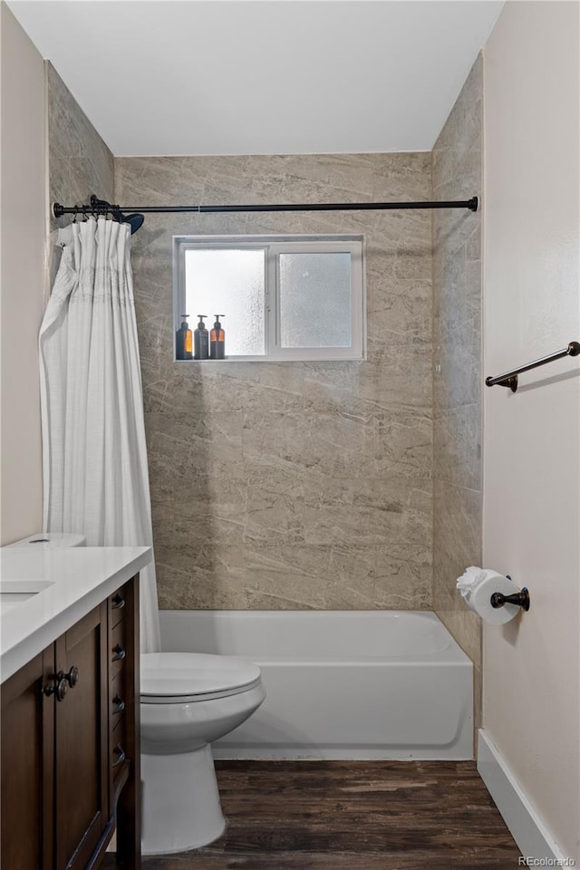 8060 Stuart Pl, Westminster, CO 80031 - full bath featuring shower / bath combo, vanity, and wood finished floors