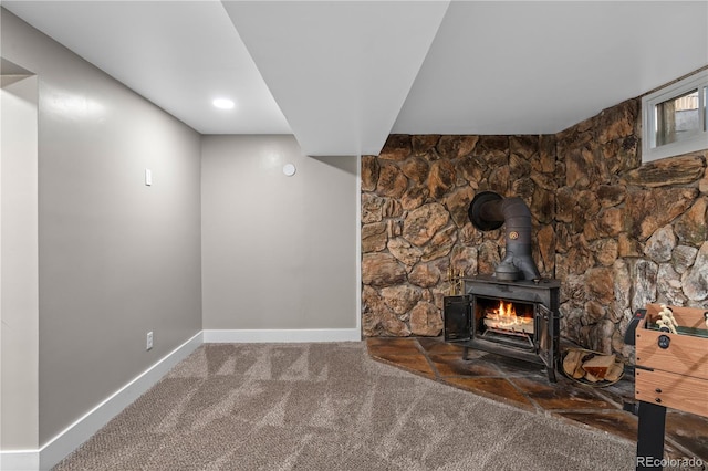 8060 Stuart Pl, Westminster, CO 80031 - unfurnished living room with carpet and a wood stove