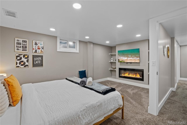 8060 Stuart Pl, Westminster, CO 80031 - carpeted bedroom featuring a glass covered fireplace and recessed lighting
