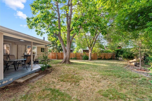8060 Stuart Pl, Westminster, CO 80031 - fenced backyard featuring a patio