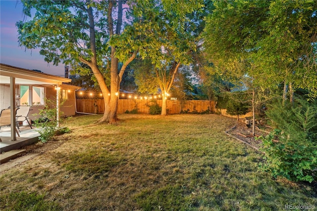8060 Stuart Pl, Westminster, CO 80031 - yard at dusk with a fenced backyard