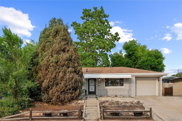 8060 Stuart Pl, Westminster, CO 80031 - view of front of home featuring driveway, an attached garage, and a porch