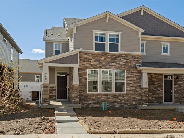 craftsman house featuring stone siding