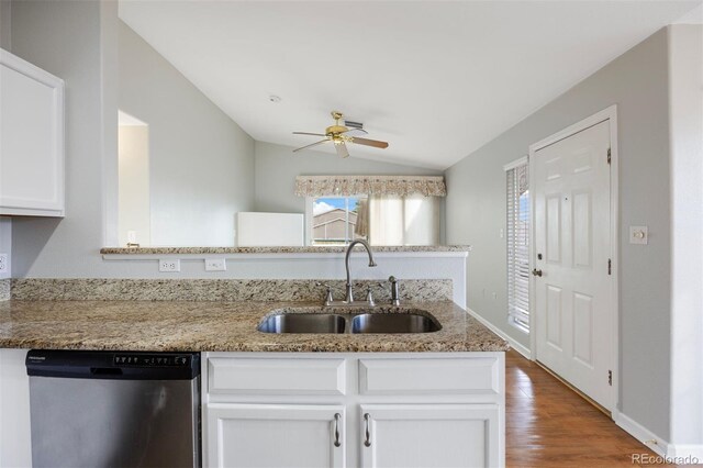3857 Mossy Rock Dr Unit 201, Highlands Ranch, CO 80126 - kitchen with dishwasher, vaulted ceiling, ceiling fan, white cabinets, and wood finished floors