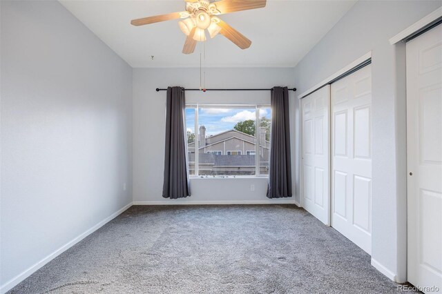3857 Mossy Rock Dr Unit 201, Highlands Ranch, CO 80126 - unfurnished bedroom featuring carpet, a closet, and a ceiling fan