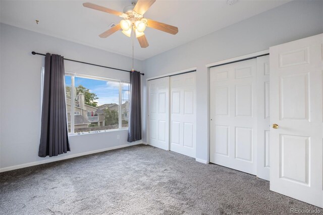 3857 Mossy Rock Dr Unit 201, Highlands Ranch, CO 80126 - unfurnished bedroom with carpet, multiple closets, and a ceiling fan
