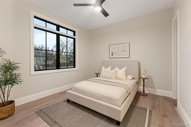 bedroom featuring ceiling fan and light hardwood / wood-style floors