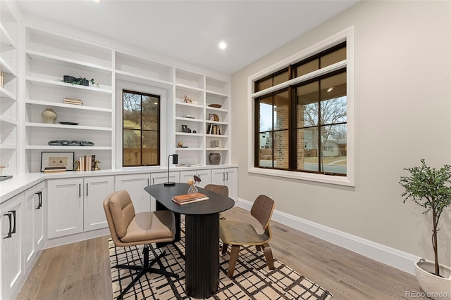 dining area featuring light wood-type flooring