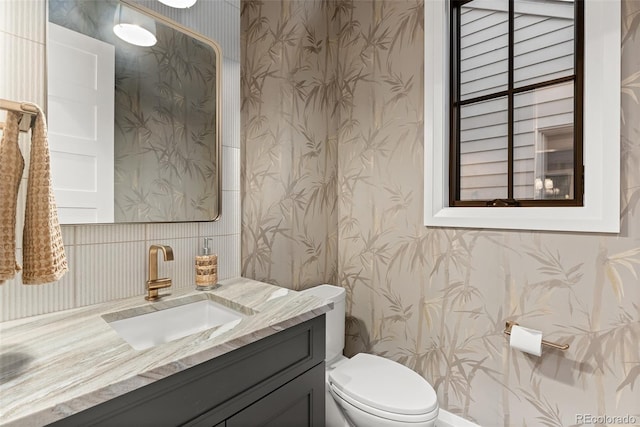 bathroom with vanity and toilet