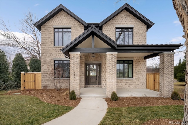 view of front of house featuring a front lawn and a porch