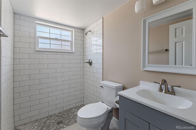 11506 Fowler Dr, Northglenn, CO 80233 - full bathroom featuring vanity, toilet, and tiled shower