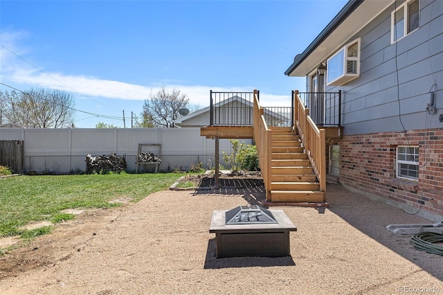 11506 Fowler Dr, Northglenn, CO 80233 - view of yard with fence, stairs, and a fire pit