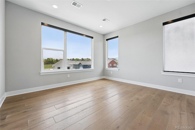 815 Promenade Dr, Superior, CO 80027 - spare room featuring plenty of natural light, wood finished floors, baseboards, and recessed lighting