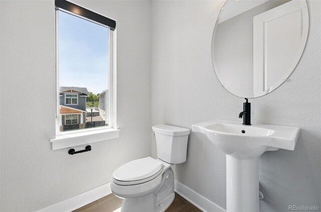 815 Promenade Dr, Superior, CO 80027 - bathroom with baseboards, wood finished floors, and toilet