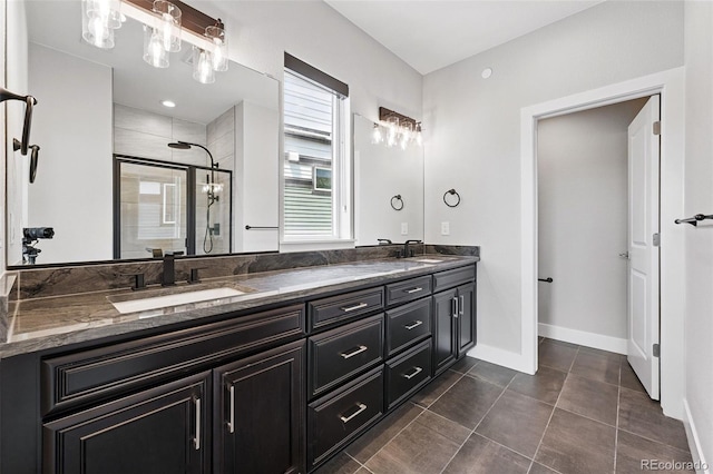 815 Promenade Dr, Superior, CO 80027 - bathroom featuring double vanity, a shower stall, baseboards, and tile patterned floors