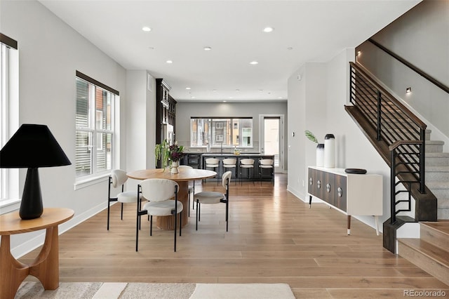 815 Promenade Dr, Superior, CO 80027 - dining space featuring light wood-style flooring, healthy amount of natural light, stairs, and recessed lighting