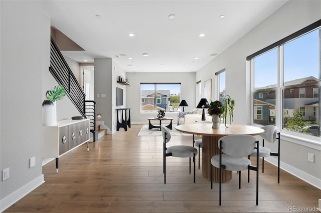 815 Promenade Dr, Superior, CO 80027 - dining room with wood-type flooring, recessed lighting, stairs, and baseboards