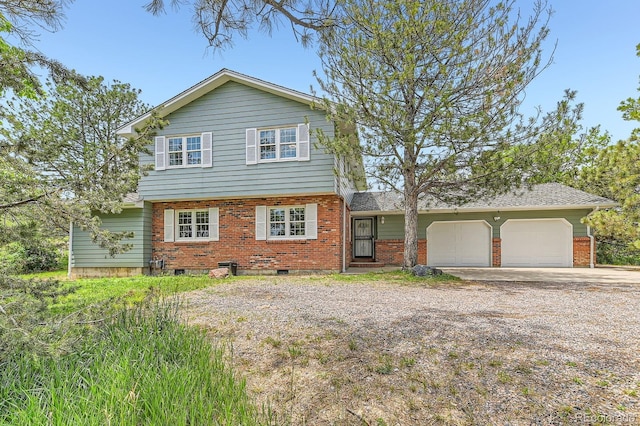 6351 S Andes Pl, Centennial, CO 80016 - view of front of property with driveway, brick siding, and a garage