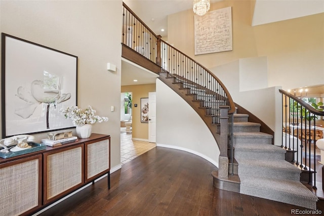 2841 Wyecliff Way, Highlands Ranch, CO 80126 - staircase featuring a high ceiling and wood finished floors