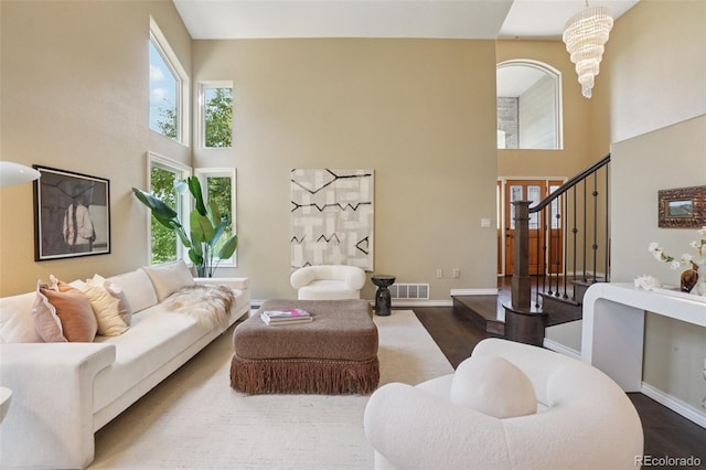 2841 Wyecliff Way, Highlands Ranch, CO 80126 - living room featuring a high ceiling, wood finished floors, and stairs