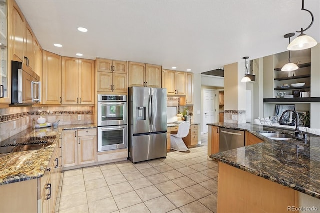 2841 Wyecliff Way, Highlands Ranch, CO 80126 - kitchen with appliances with stainless steel finishes, light brown cabinetry, dark stone counters, decorative backsplash, and hanging light fixtures