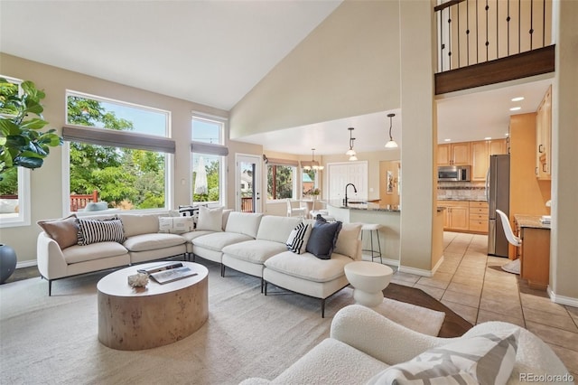 2841 Wyecliff Way, Highlands Ranch, CO 80126 - living area featuring a towering ceiling, light tile patterned flooring, recessed lighting, and a chandelier