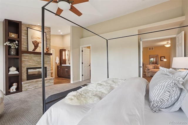2841 Wyecliff Way, Highlands Ranch, CO 80126 - bedroom featuring carpet flooring, a fireplace, and a ceiling fan