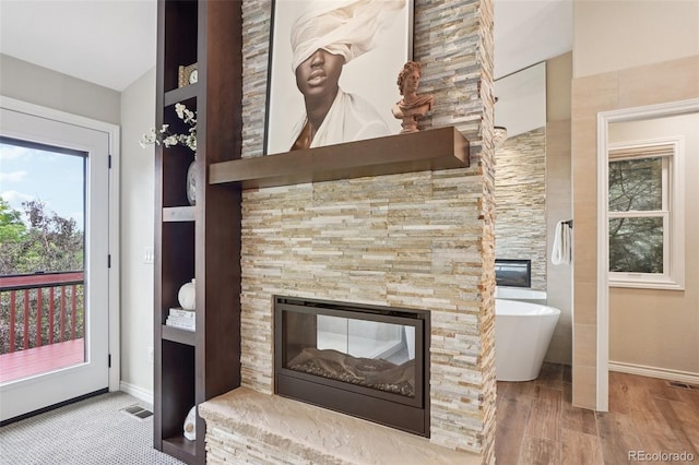 2841 Wyecliff Way, Highlands Ranch, CO 80126 - detailed view of a multi sided fireplace and wood finished floors